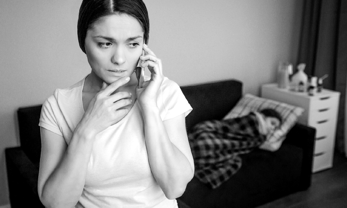 mother on phone looking worried